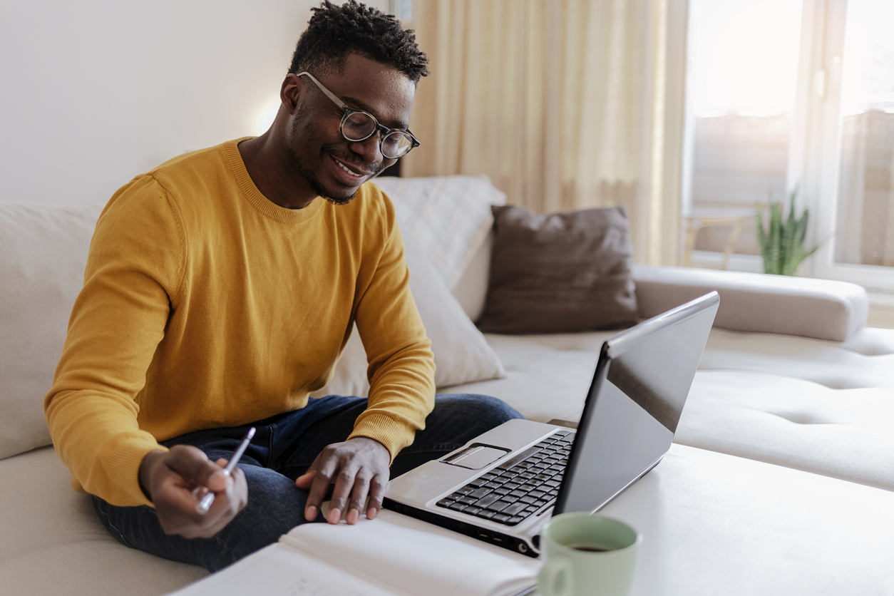 Man submitting a job application on his laptop